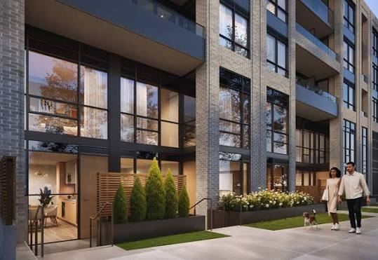 Townhome-style strata building entrance with landscaping